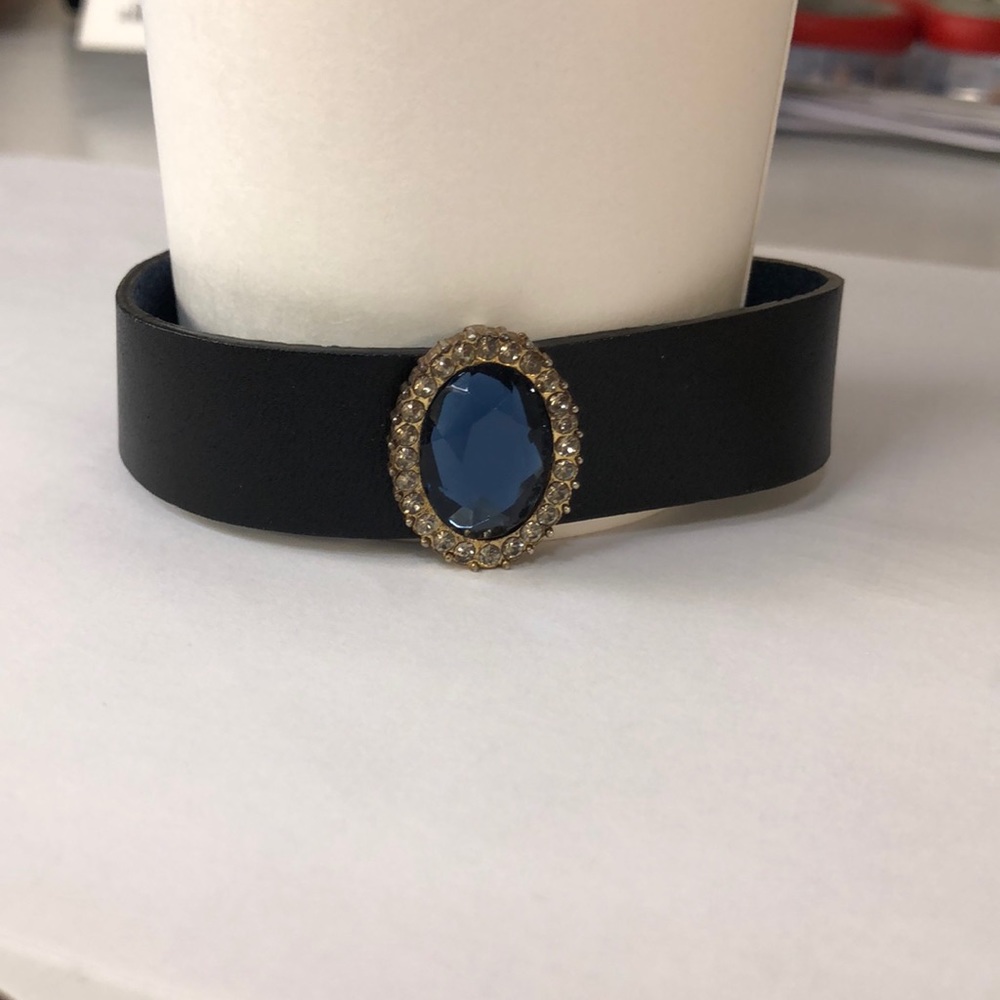 Black leather cuff bracelet with faux jewel